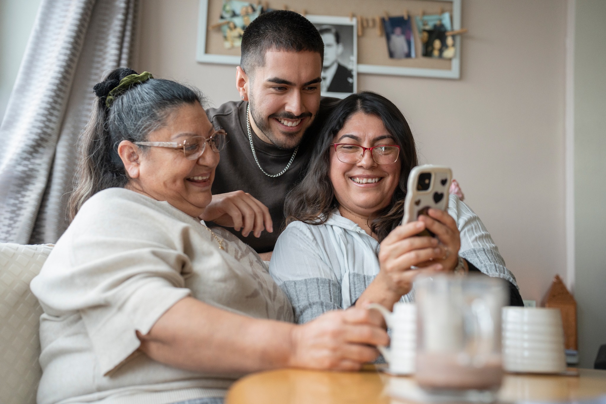 People looking at a phone together